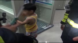 Firemen free boy's fingers from door