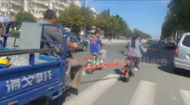 Teenagers tow truck with motor scooters