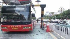 Double decker crashes into the heigh-limit barrier
