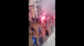 Marseille football fans run from police in Groningen