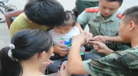 Firemen remove nut off girl's finger with thread