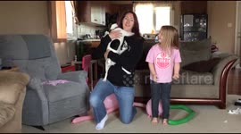 Dog taught how to hug owner