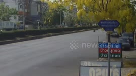 Pick-up truck topples over after hitting loose wheel