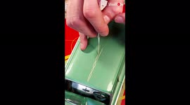 'Pinstripe artist GLAMS UP a scale model Ford car 
'