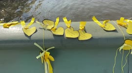 Covid-19: Flowers and ribbons on Westminster Bridge for the National Day of Reflection