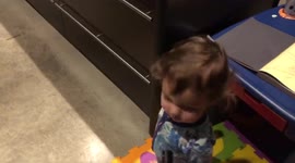 Toddler decides to give his baby brother bengal cat singing lessons