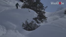 'Skier crashes into snow after backflip attempt off a cliff doesn't go as planned
'