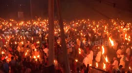 Thousands of devotees turn night into day with torches at south Indian festival