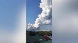Huge clouds of white vapour erupt from Taal Volcano in the Philippines