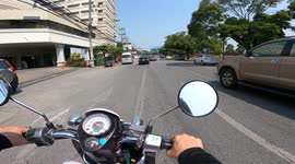 going Thailand Chianmai hospital by motorbike and parking in front of parking guard house