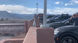 Onlookers Watch From Table Mesa Parking Garage As NCAR Wildfire Spreads Outside of Boulder Colorado