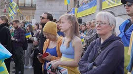 Young girl watching stand at the 'London Stands with Ukraine: March and Vigil' 26/03/22
