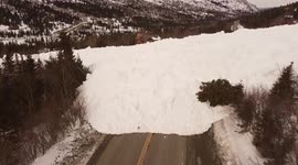 Strong drone footage shows avalanche blockading road in Alaska