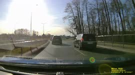 Half lane driving by two cars on roundboat causing dangerous situations