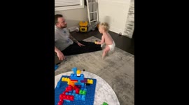 'Funny baby boy mimics his mom by asking dad for a massage '