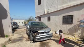 Palestinians inspect burned vehicles in an arson attack by Israeli settlers near the West Bank village of Jalud southern Nablus.