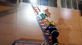 Firefighters use guitar bag and bucket to transfer children out of burning building