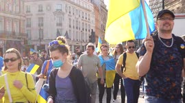 People walking to Trafalgar Square for the London Stands with Ukraine: March and Vigil