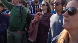 People in a crowd clapping at the London Stands with Ukraine: March and Vigil