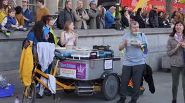 Man getting food from stand at the London Stands with Ukraine: March and Vigil