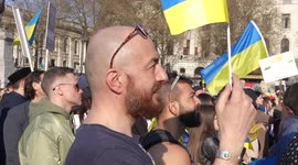 Side view of man watching the stage at the London Stands with Ukraine: March and Vigil