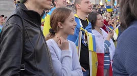 Young blond girl watching stage at the London Stands with Ukraine: March and Vigil