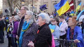 Side view of a crowd watching stage at the London Stands with Ukraine: March and Vigil