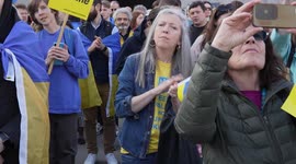 Woman watching stage at the London Stands with Ukraine: March and Vigil