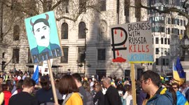 People holding placard of Putin looking like Hitler at the London Stands with Ukraine: March and Vigil