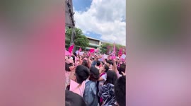 Crowd erupts into song during rally for female presidential candidate in the Philippines