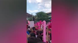 Supporters of Philippine vice president chant and cheer in unison during election rally