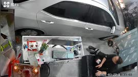Car narrowly misses man after smashing into hair salon in China