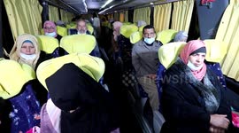 Relatives of Palestinian prisoners in Israeli prisons cross by bus at the Erez border crossing