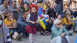 Little girl with Ukraine flag at the London Stands with Ukraine: March and Vigil
