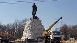Statue of Ukrainian poet Tara Shevchenko covered by sand bags to protect it from shelling