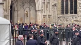 Crowds and news cameras try to catch a glimpse outside Prince Philip’s memorial service at Westminster Abbey