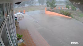 Powerful thunderstorm pushes metal gate shut while battering village in northern Thailand