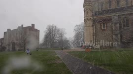 Snow falls on St Albans Cathedral as cold weather strikes the UK