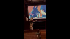 'Goofy pug wants to sniff the dog appearing on TV 
'