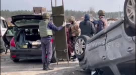 Ukrainian forces help residents of damaged Irpin flee from city