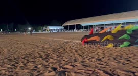 Huge kite drags three men along beach during show in Thailand