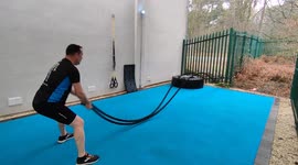 Man training with battle ropes in an outdoor gym Harrogate North Yorkshire