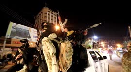 Palestinian militants from the Al-Quds Brigades, the armed wing of the Islamic Jihad movement, take part in a military parade, in Khan Younis in the souther of Gaza Strip.