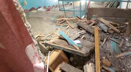 Videographer attempts to walk through ruined interior of apartment in Okhtyrka, Ukraine