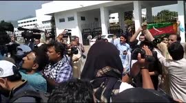 Supporters shout slogans outside Pakistan assembly in support of PM Imran Khan