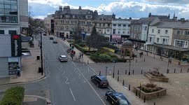 Moving Sunday daytime traffic in Harrogate city centre North Yorkshire UK