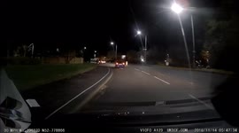 Cyclist riding on pavement manages to fall off his bike into the road, it was lucky he didn't get run over.