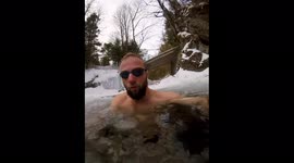 Slovakian daredevil dives under frozen lake and goes for icy-cold swim