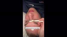 Man not impressed after wife pretends to cut his eyebrows in hilarious prank