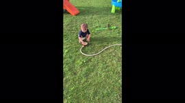 ''Baby DOWN!' Heedless puppy rolls over and knocks down baby boy '